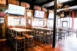 Bar top seating in front of keg fridges