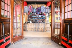 Dover store with merch clothes hanging on wall