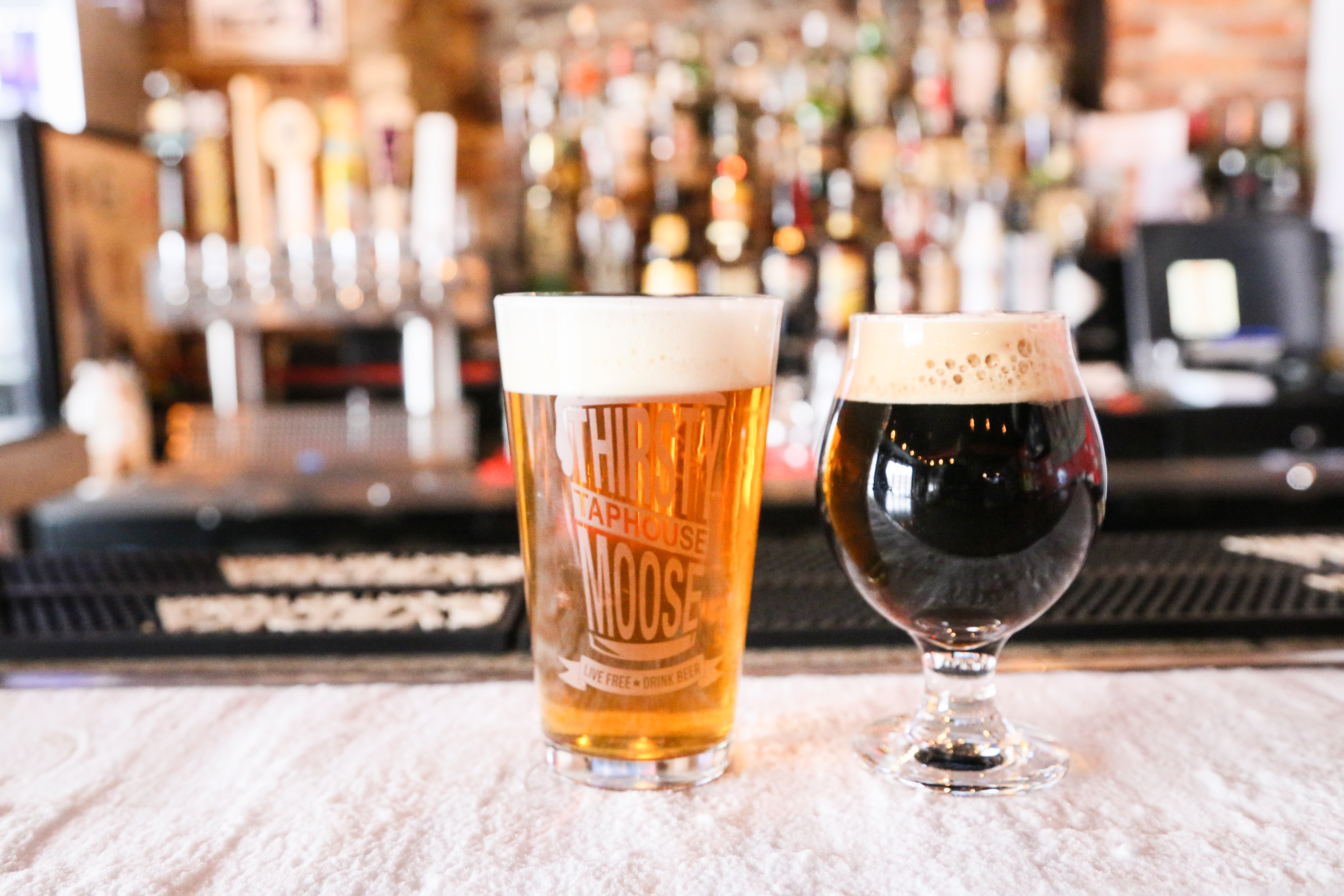 Thirsty Moose light and dark beer on bar