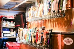 Selection of beer taps behind the bar